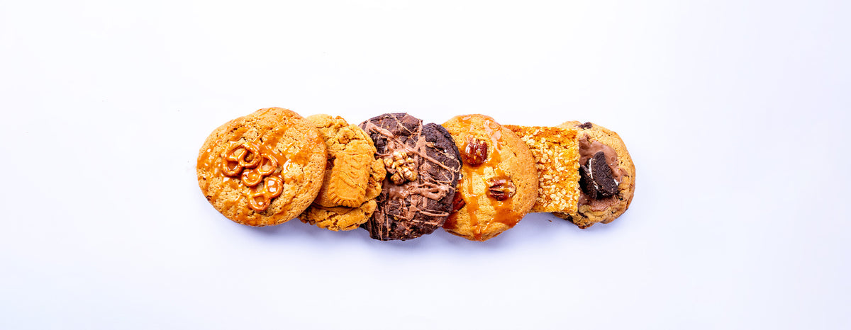 A hand reaching for a MONO cookie